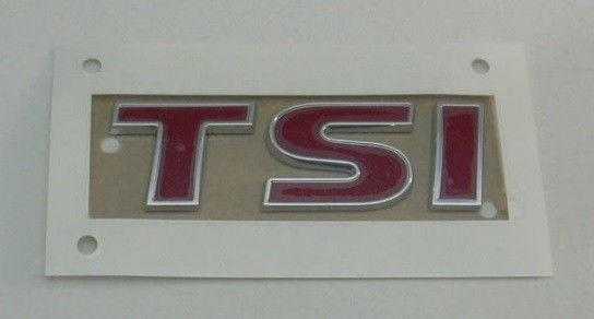 VAG VW TIGUAN GOLF EOS galinės bagažinės TSI emblema originalus 1Q0853675QGQF