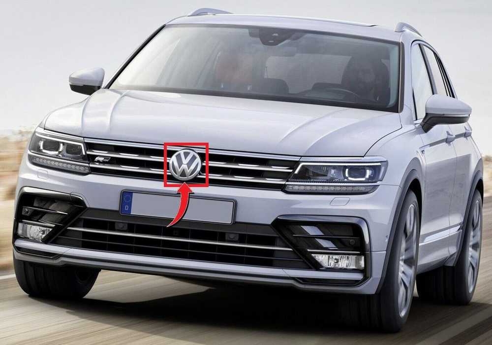VAG VW TIGUAN priekinio bamperio radiatoriaus grotelės ženkliukas originalus 2K5853600