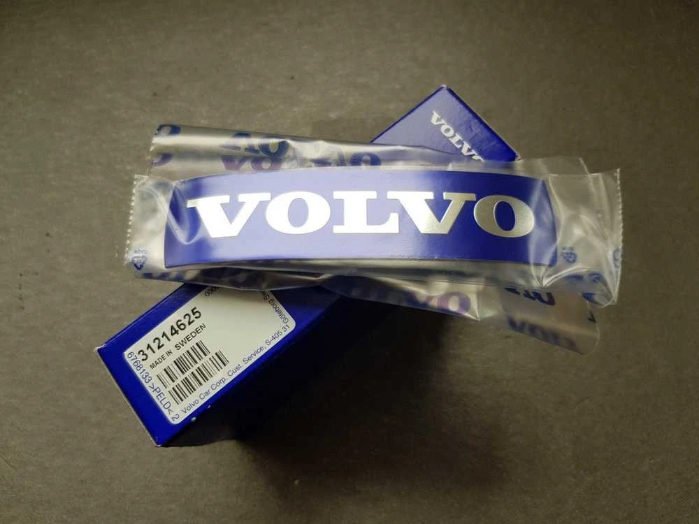 "Volvo S60 V60 V70 XC70" priekinės grotelės emblema Metalinis lipdukas Originalus 31214625