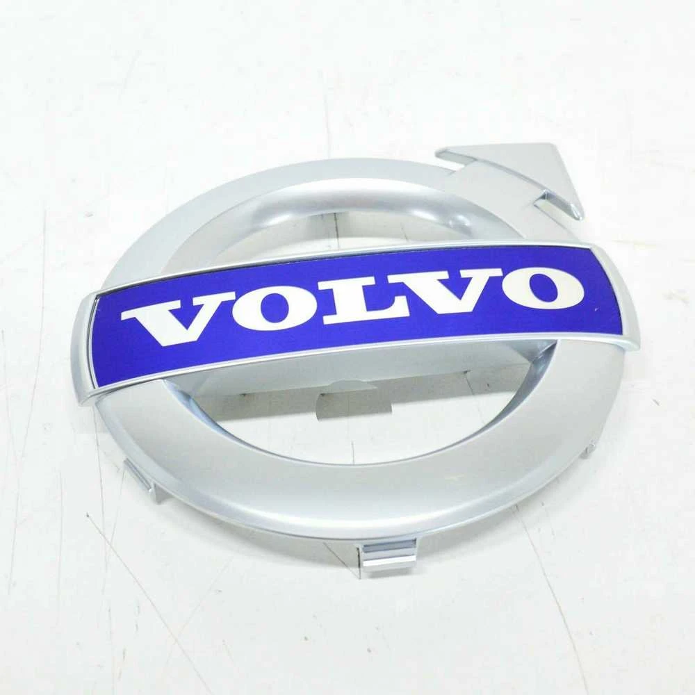 VOLVO XC70 MK2 priekinio bamperio grotelių emblema Originali 31383032