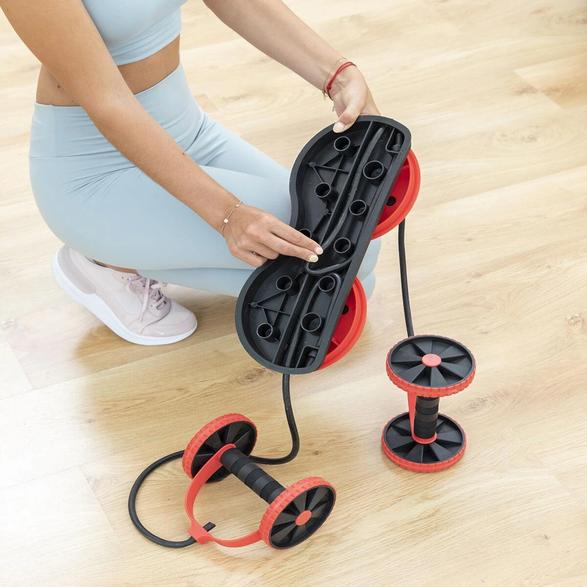 Pilvo volelis su besisukančiais diskais, elastinėmis juostomis ir pratybų vadovu Twabanarm InnovaGoods