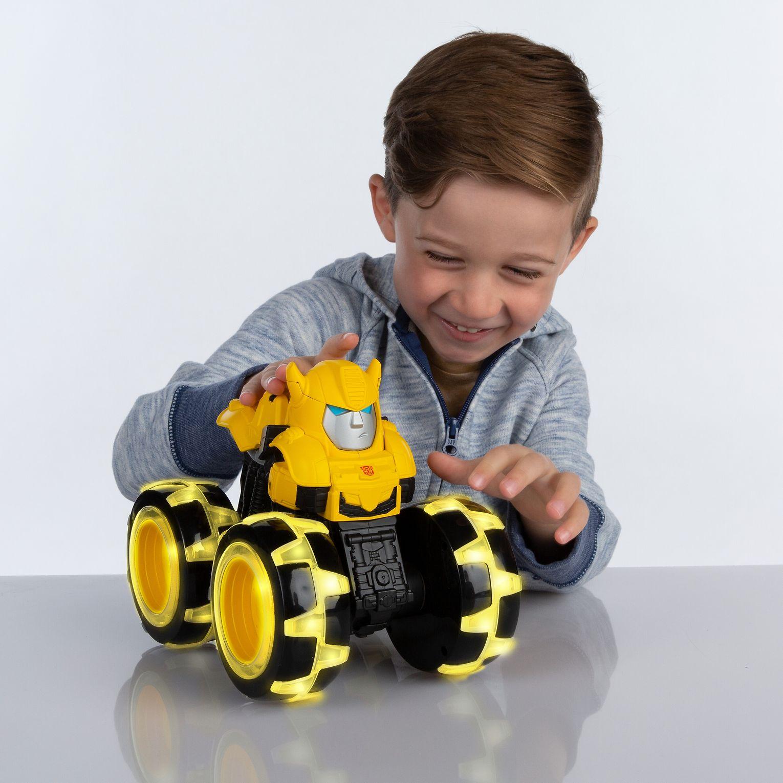 Tomy JOHN DEERE traktorius su šviečiančiais ratais Optimus Prime, 47423