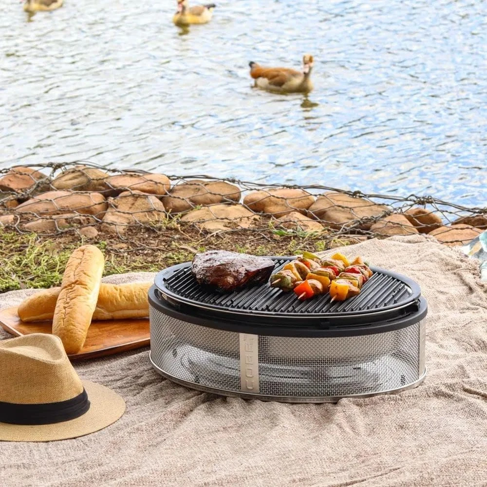 Kelioninis / pikniko anglinis grilis COBB Supreme 2.0 kartu su Griddle+ kepimo plokštuma