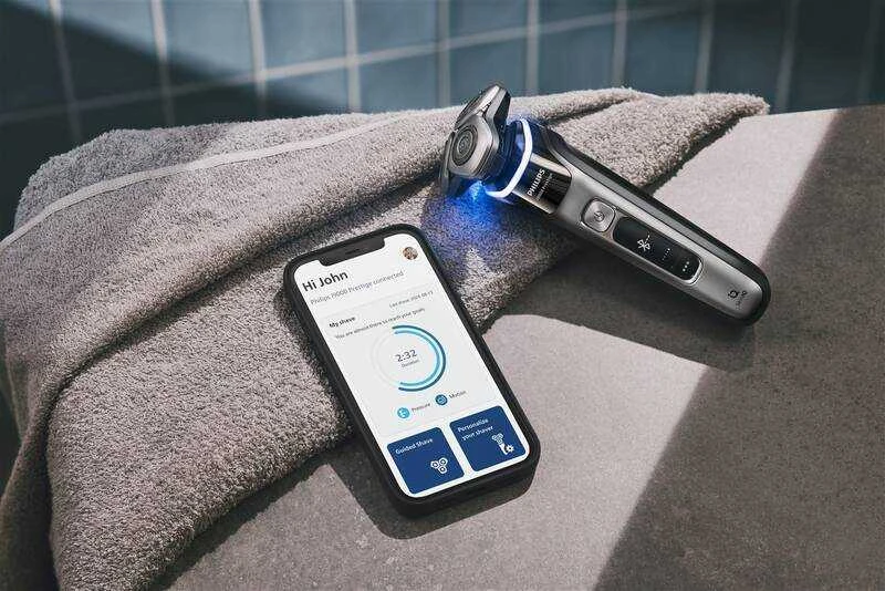 Philips i9000 Prestige drėgnojo ir sausojo skutimo skustuvas su „SkinIQ“
