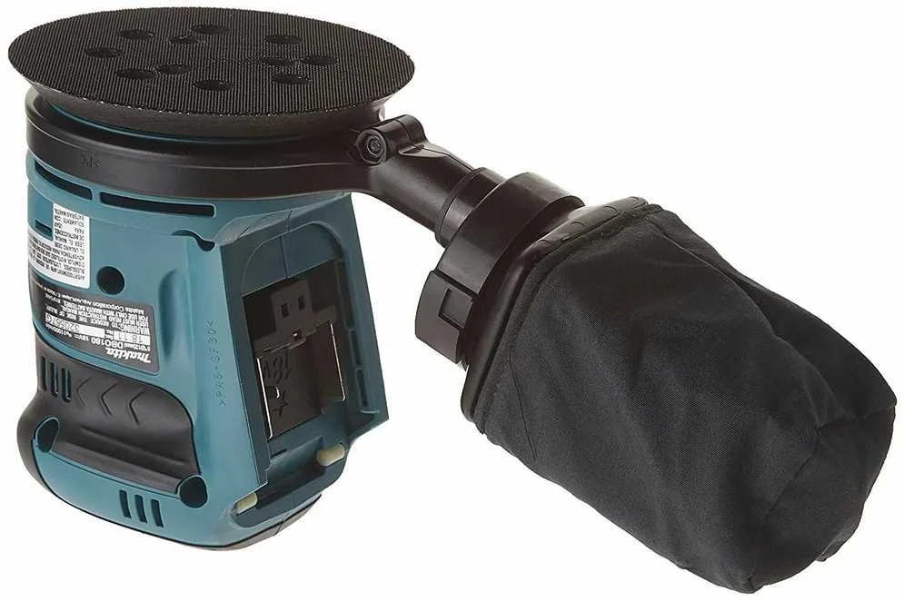 Makita DBO180Z su dulkių maišeliu ir šlifavimo padu
