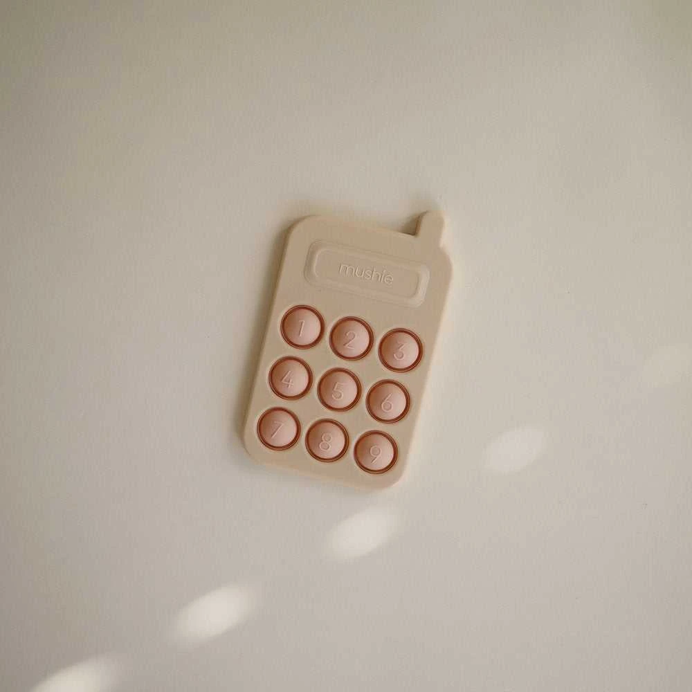Mushie pop it žaislas Telefonas Blush