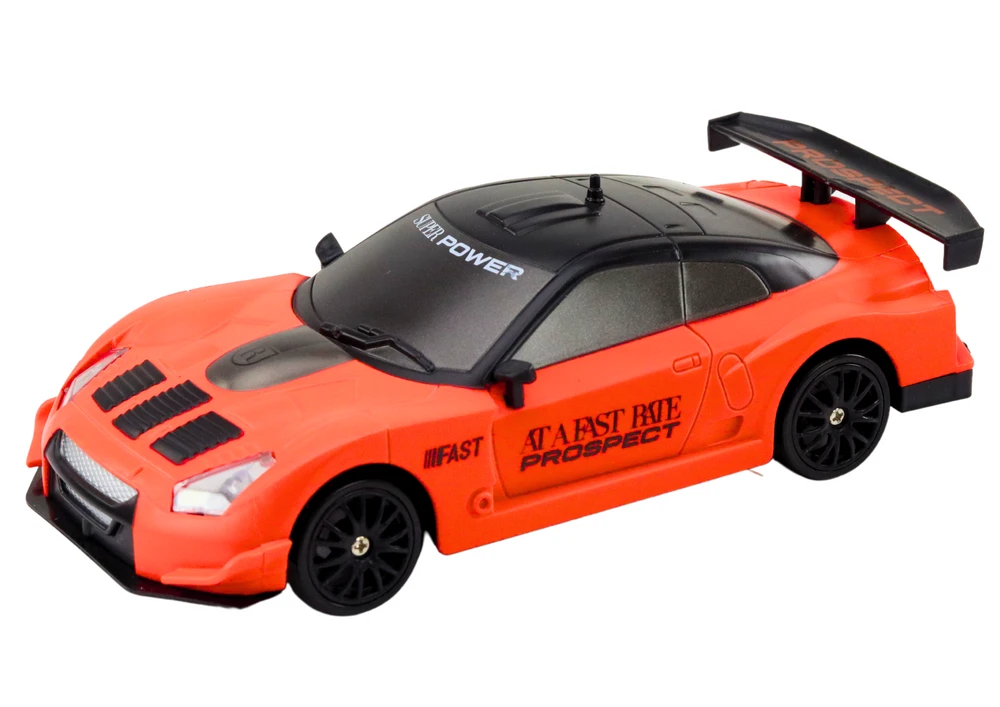 Sportinis automobilis R/C 1:24 su nuotolinio valdymo pultu ir keičiamais ratais, oranžinis