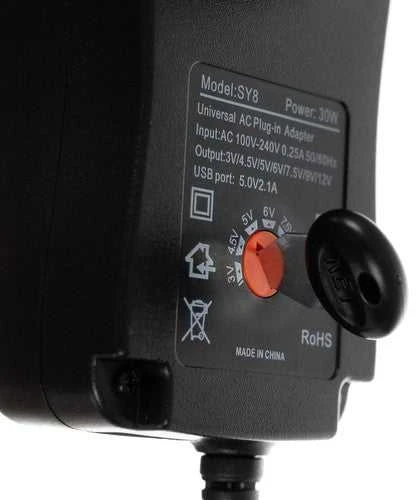 Universalus įkroviklis, maitinimo šaltinis 3-12V AC 100 - 240 0.25A 50/60Hz