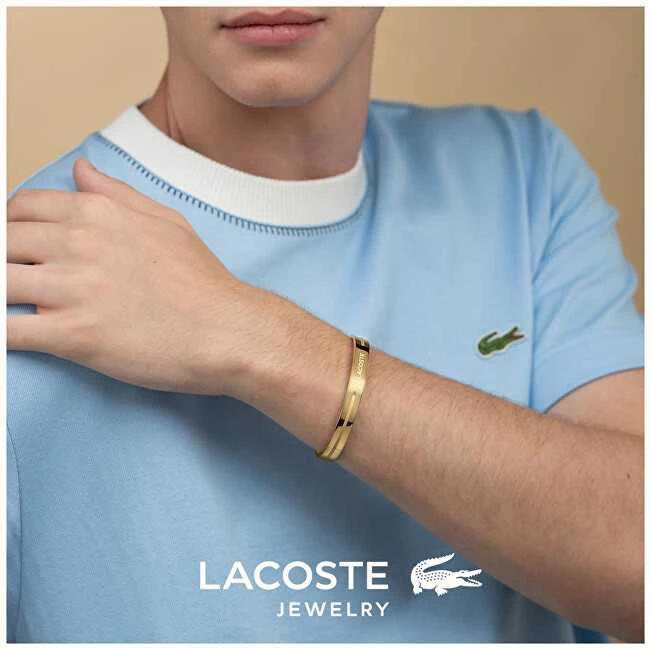 Lacoste Nuotykių ieškotojo paauksuota plieninė atvira vientisa apyrankė 2040527