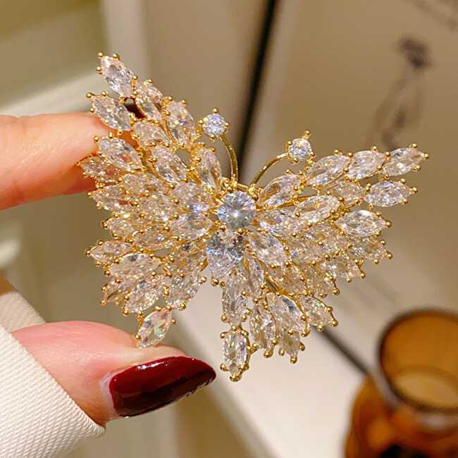Troli Blizganti auksu dengta sagė „Butterfly Gold“
