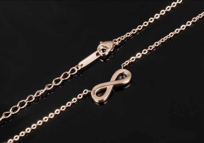 Troli Rožinis paauksuotas plieno karoliai Infinity KNS-271