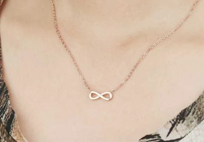 Troli Rožinis paauksuotas plieno karoliai Infinity KNS-271