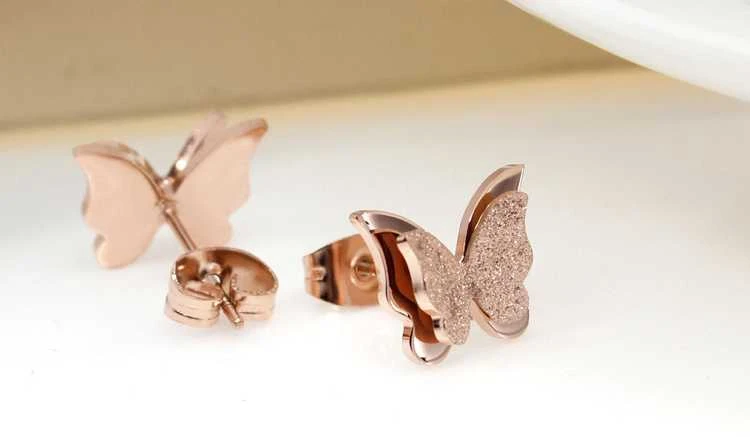 Troli Maži drugelių auskarai Metaliniai drugeliai KES-048-ROSEGOLD