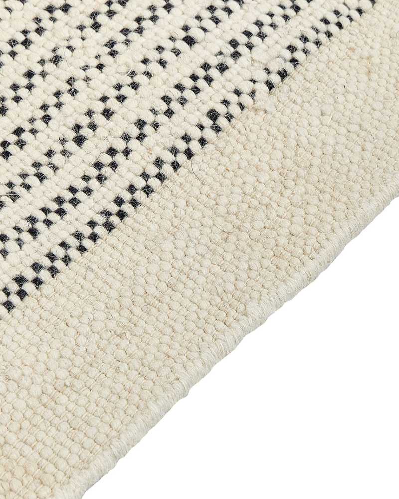 Beliani Kilimas DIVARLI smėlio spalvos 80 x 150 cm vilnonis