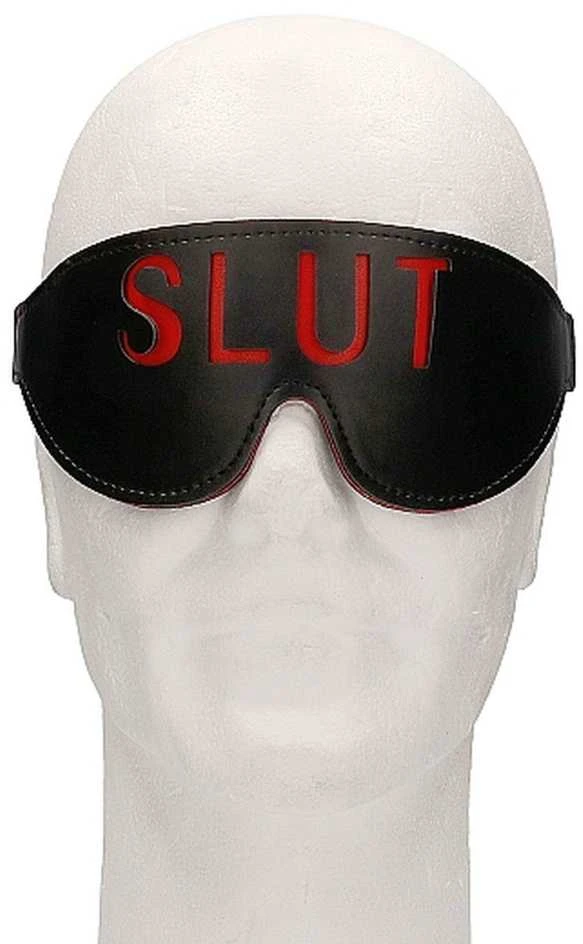 Juoda akių kaukė su užrašu SLUT