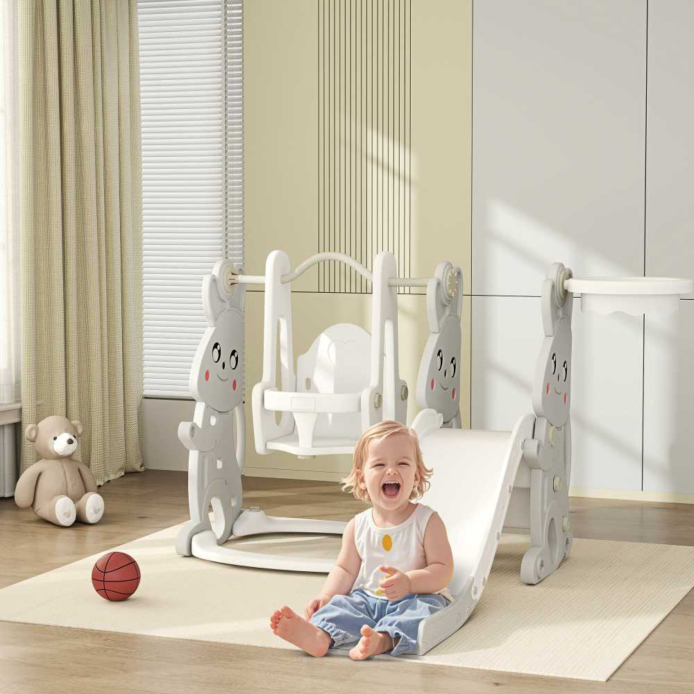 AIYAPLAY čiuožykla "4-in-1" vaikų čiuožykla su sūpynėmis, laipiojimo rėmu, krepšinio lanku, vaikų žaidimų aikštele su zuikio dizainu Mažylių čiuožykla, skirta 1,5-4 metų amžiaus vaikams viduje ir lauke Pilka spalva
