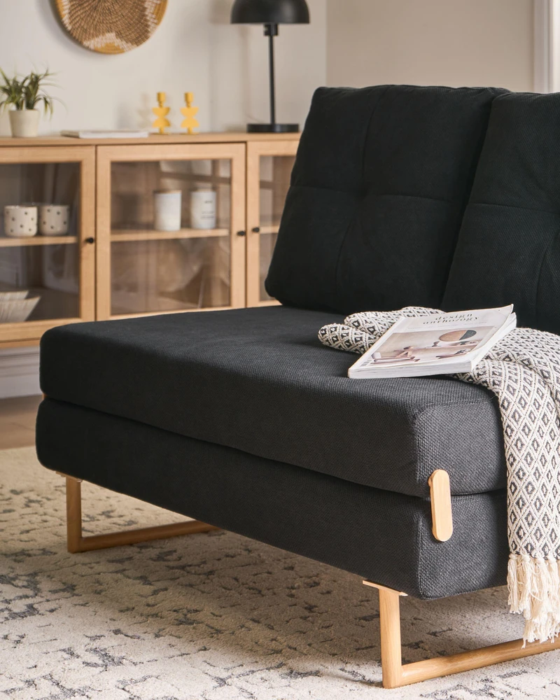 Beliani Dvivietė išskleidžiama sofa JERSLEV Juoda