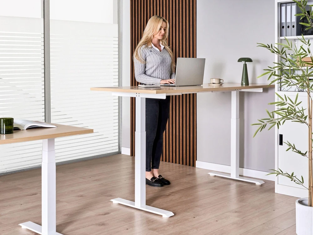 Beliani Elektriškai reguliuojamas stalas DESTINES šviesiai ruda/balta 180 cm 72 cm