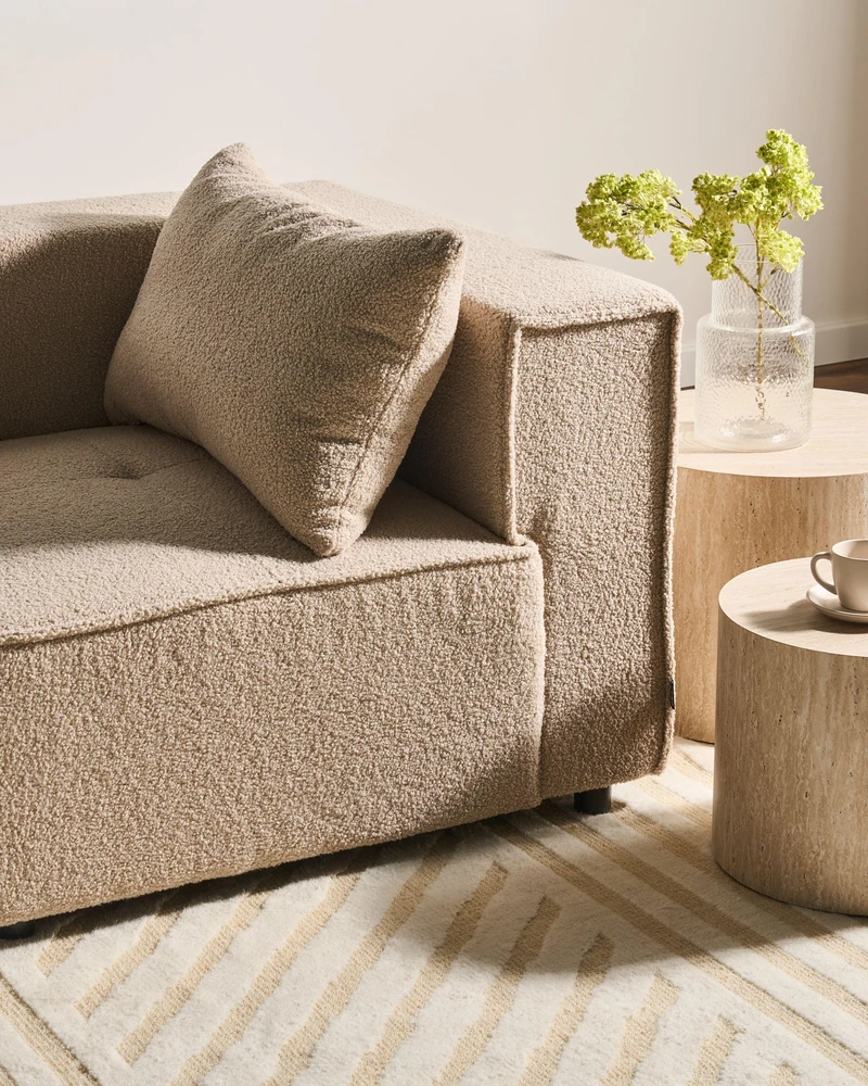 Beliani Trijų vietų modulinė sofa AXEBO, smėlio spalvos „boucle“ audinys