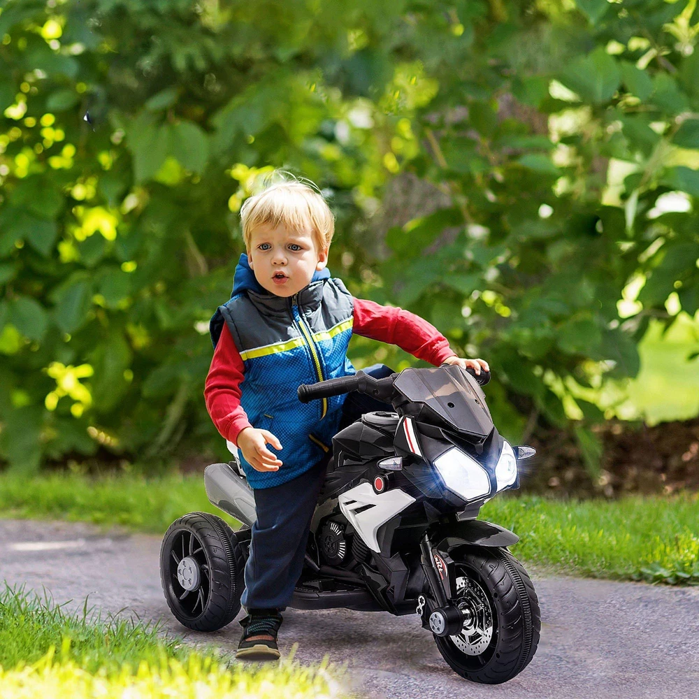 Vaikiškas elektrinis motociklas HOMCOM, šviesos ir garsai, 3 km/h, įkraunamas, plastikas ir metalas, juoda/balta