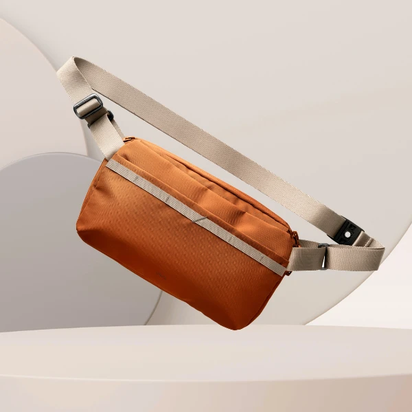 Krepšys Crossbody UNIQ Denver 5L oranžinės spalvos aprašymas - Prekės nuotrauka Krepšys Crossbody UNIQ Denver 5L oranžinės spalvos aprašymas - Prekės nuotrauka