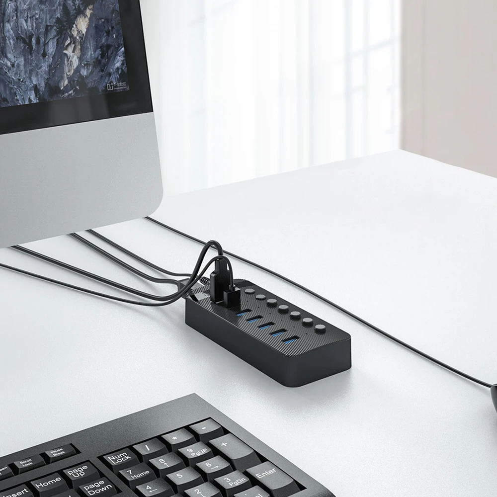 „Orico CT2U3-7AB“ 7x USB-A 3.0 šakotuvas su jungikliais – juodos spalvos