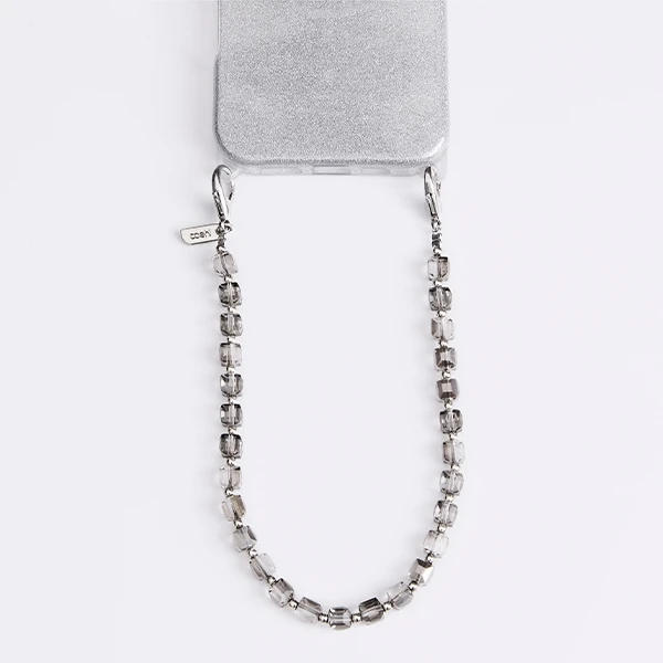 UNIQ Coehl Candy Gem Handstrap universal phone strap for hand sidabro spalvos/sidabro spalvos spar