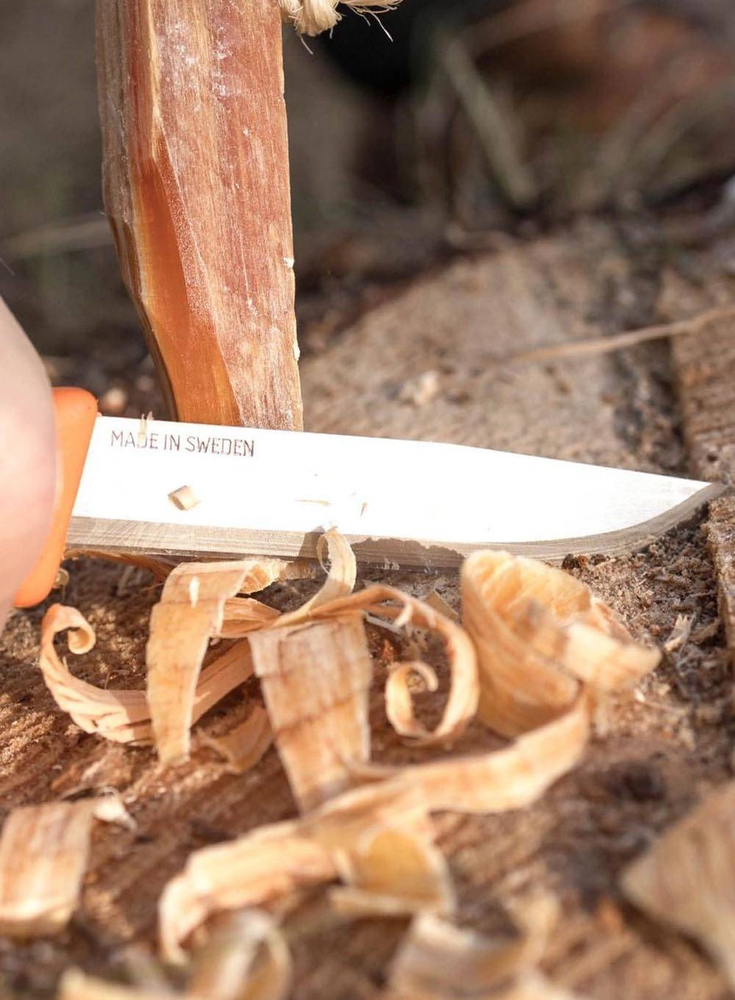 Carruzzo Morakniv "Light My Fire FireKnife" žalios spalvos peilis su akmenukais