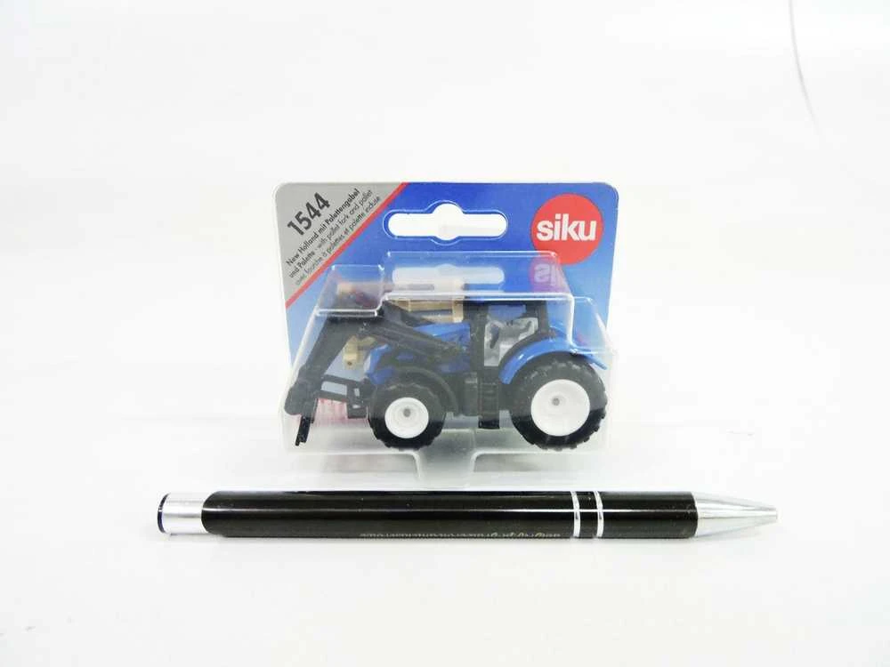 Siku Traktorius su šakėmis ir New Holland padėklais