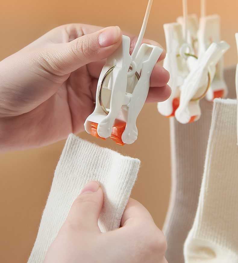 Plastikinis sulankstomas drabužių kabykla su 19 spaustukų - balta