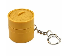 Lean Toys Raktų pakabukas su šviečiančiu koldūnu ir atverčiamu dangteliu, 3,5 × 3,5 cm