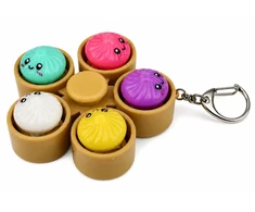Lean Toys Suktukas-raktų pakabukas su 5 šviečiančiais koldūnais, daugiaspalvis, 9,5 × 9,5 × 3,5 cm