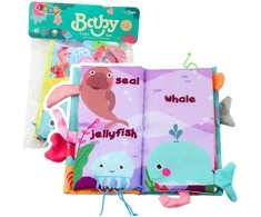 Lean Toys Minkšta jutiminė jūrų gyvūnų knygelė su švilpuku ir čežančiu popieriumi