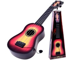 Žaislinė gitara su metalinėmis stygomis ir mediatoriumi, tamsi