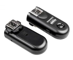 A set of two Yongnuo RF603C II flash triggers with a C3 for Canon cable