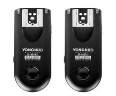 A set of two Yongnuo RF603C II flash triggers with a C3 for Canon cable