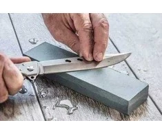 Double-sided whetstone sharpening scythe blades