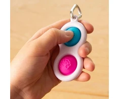 Fat Brain Toys Sensorinis žaislas - raktų pakabukas „Simpl Dimpl“ (įvairių spalvų)