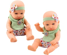 Lean Toys Lėlė kūdikis su žaliais drabužiais ir galvos juosta, 29 cm