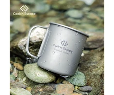Cook'n'escape titan 300 ml kempingo puodelis, skirtas maisto gaminimui ant atviros ugnies, su sulankstomomis rankenėlėmis, skirtas iškyloms gamtoje ir žygiams