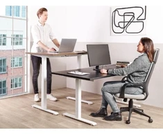 Beliani Biurko regulowane elektrycznie DESTINES Juodas/ balta 120 cm 72 cm