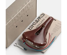 Brooks Balnelis BROOKS B17 CARVED, rudos spalvos, plieniniai lankeliai, svoris 520 g, linija Leather