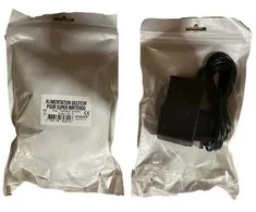 Trade Invaders „Super Nintendo“ kintamosios srovės adapteris (maišeliuose su etiketėmis, skirtomis keistuoliams ir kompiuterių fanatikams)