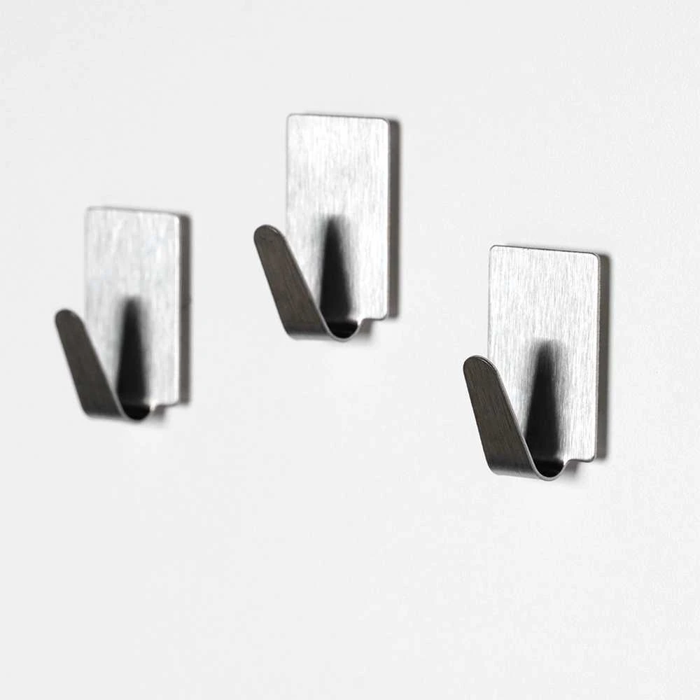 Orion Plieniniai klijuojami kabliukai 1,8x2,5 cm