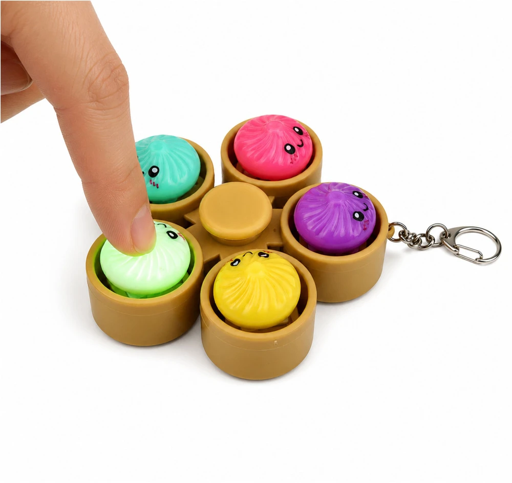 Lean Toys Suktukas-raktų pakabukas su 5 šviečiančiais koldūnais, daugiaspalvis, 9,5 × 9,5 × 3,5 cm