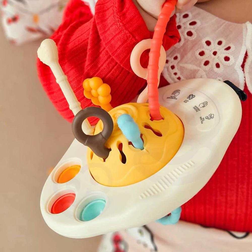 Montessori sensorinis barškutis UFO WOOPIE BABY