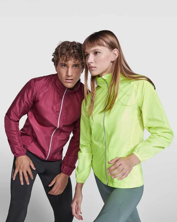 Roly Lengva ir kvėpuojanti prigludusi vėjo striukė su reglano rankovėmis GLASGOW WOMAN Fluoro geltona