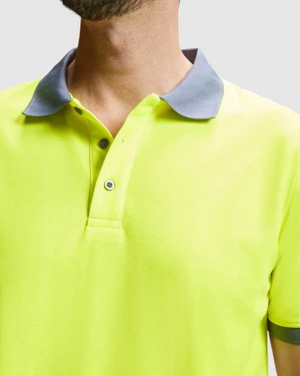 Roly Techniniai gerai matomi trumpomis rankovėmis polo marškinėliai ATRIO Fluoro geltona