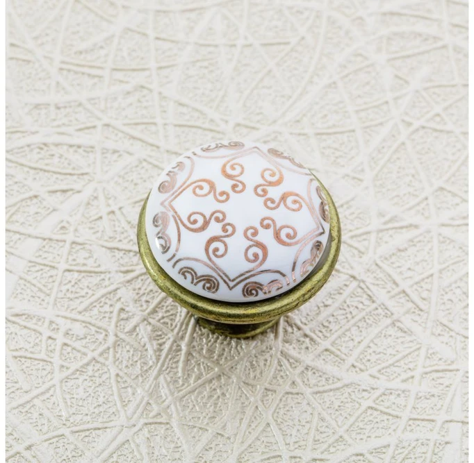 Porcelain knob 728-J4 antique brass C-Orient Gold