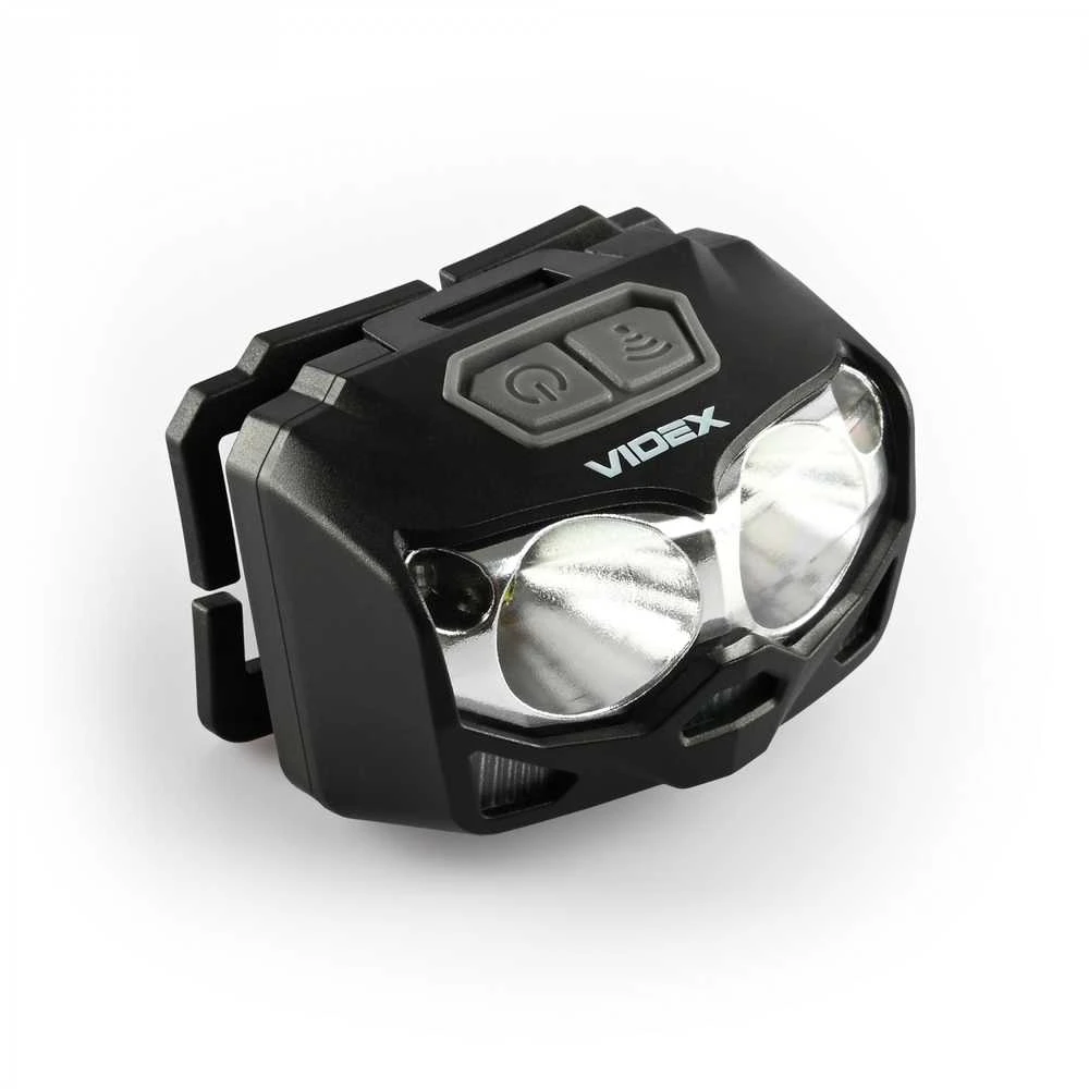 Videx Įkraunamas galvos žibintas su judesio jutikliu LED 2xCREE XTE 5W 500Lm 5000K, Li-ion VLF-B12 1200mAh kai 3xAAA, VLF-H055D – Hibridinis maitinimas iš keičiamo akumuliatoriaus arba AAA baterijų